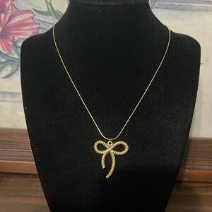 Gold plated stainless steel bow pendant necklace